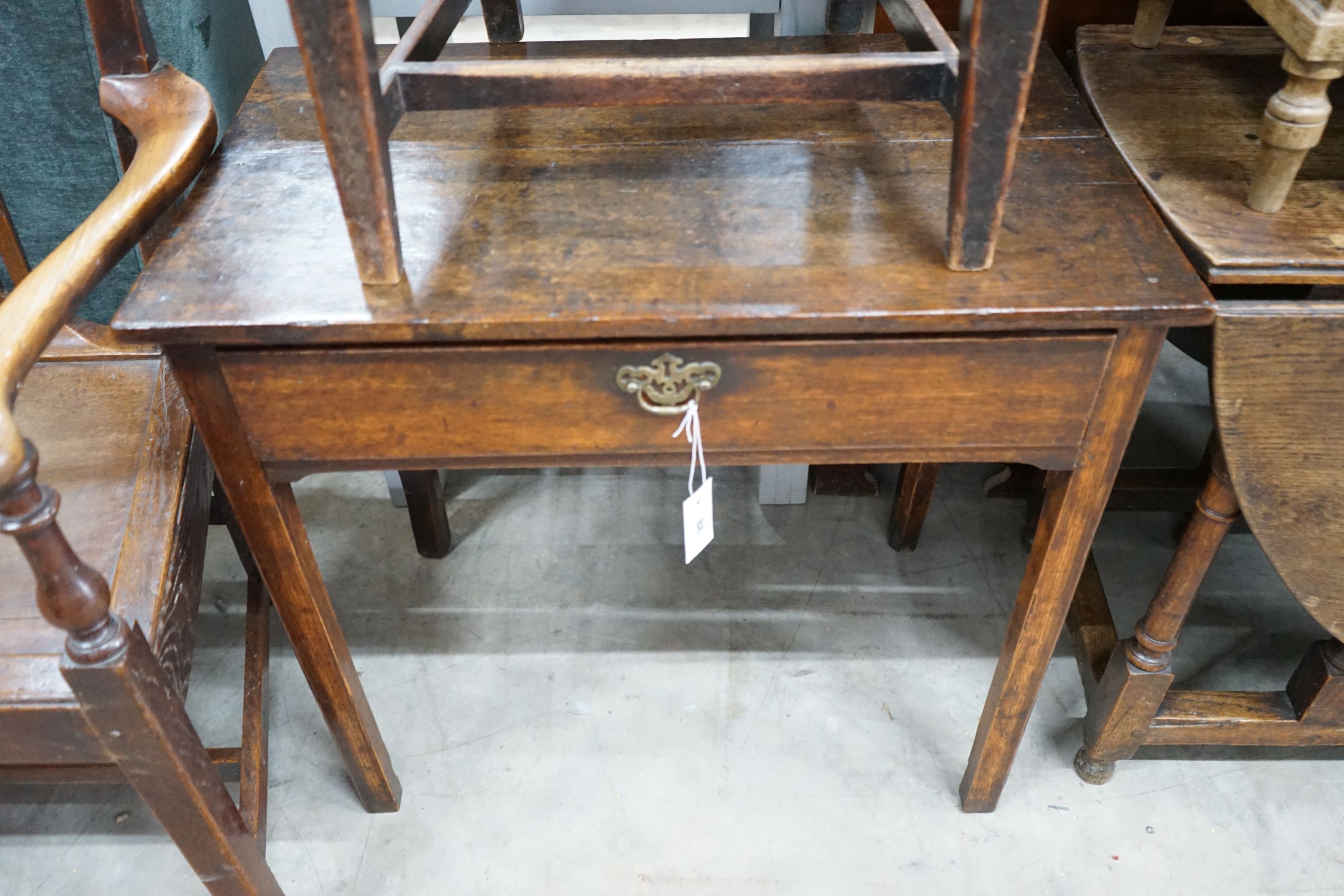 A small George III oak side table, width 75cm, depth 47cm, height 71cm and a wood seat oak chair